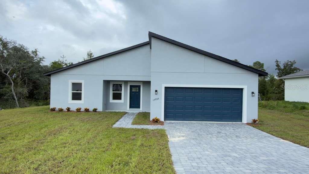 14905 Southwest 24th Circle Ocala, FL 34472 - Photo 3 of 24 a front view of house with yard
