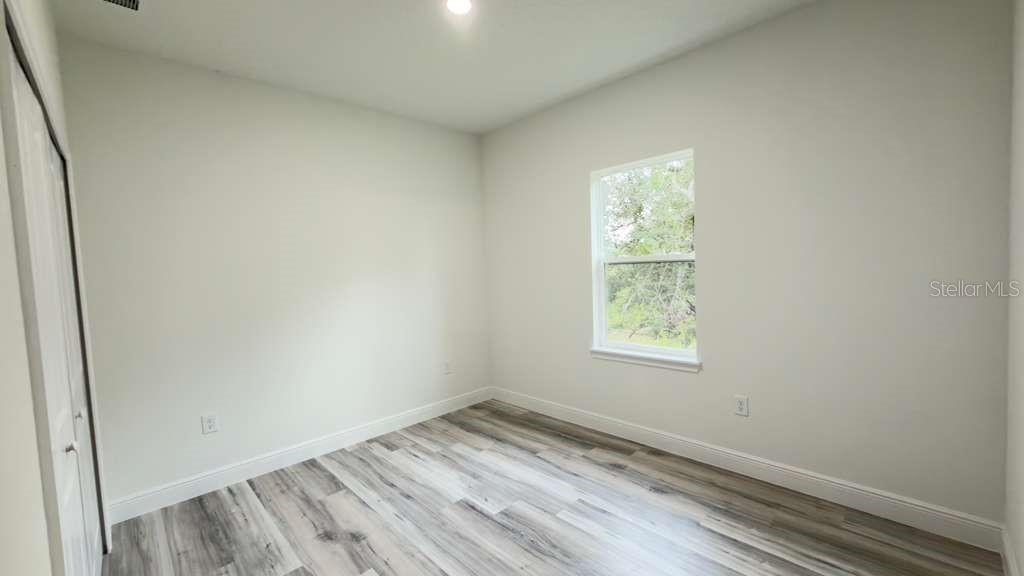 14905 Southwest 24th Circle Ocala, FL 34472 - Photo 7 of 24 an empty room with a window
