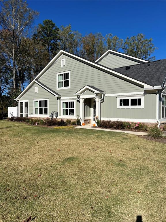 704 Calypso Way Cumming, GA 30040 - Photo 2 of 33 a house with trees in the background