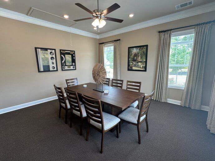 704 Calypso Way Cumming, GA 30040 - Photo 8 of 33 a view of a dining room with furniture and window