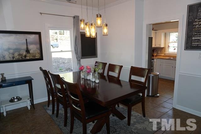 215 Danforth Drive Cary, NC 27511 - Photo 2 of 25 a view of a dining room with furniture and chandelier
