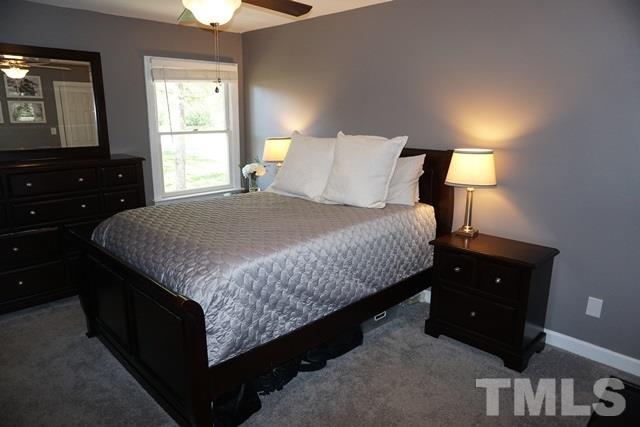 215 Danforth Drive Cary, NC 27511 - Photo 12 of 25 a bedroom with a bed and a closet