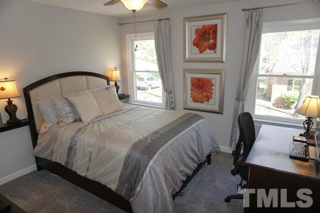 215 Danforth Drive Cary, NC 27511 - Photo 17 of 25 a bedroom with bed and a window