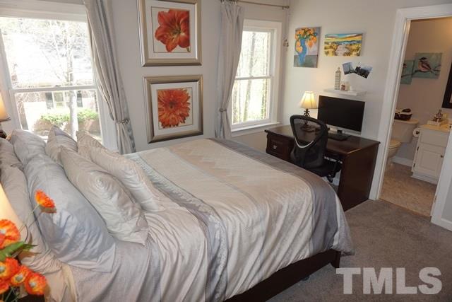 215 Danforth Drive Cary, NC 27511 - Photo 18 of 25 a bedroom with a bed and a window