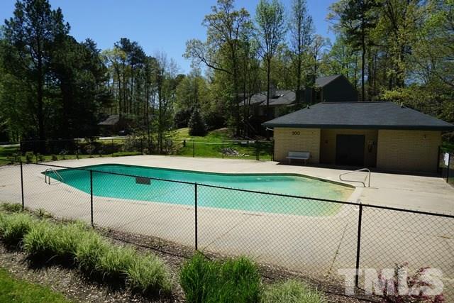 215 Danforth Drive Cary, NC 27511 - Photo 23 of 25 a green field with trees in the background
