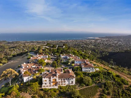 a living room with stainless steel appliances granite countertop furniture a kitchen view living room and a couch