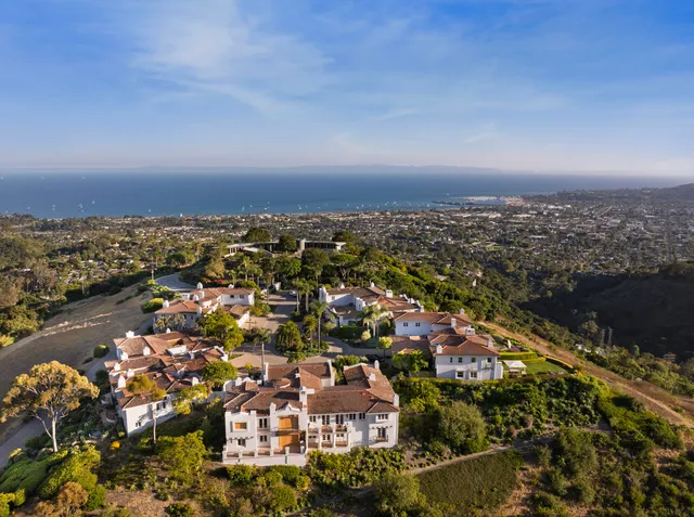 a living room with stainless steel appliances granite countertop furniture a kitchen view living room and a couch
