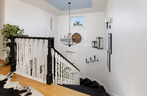 a view of a entryway with furniture and wooden floor