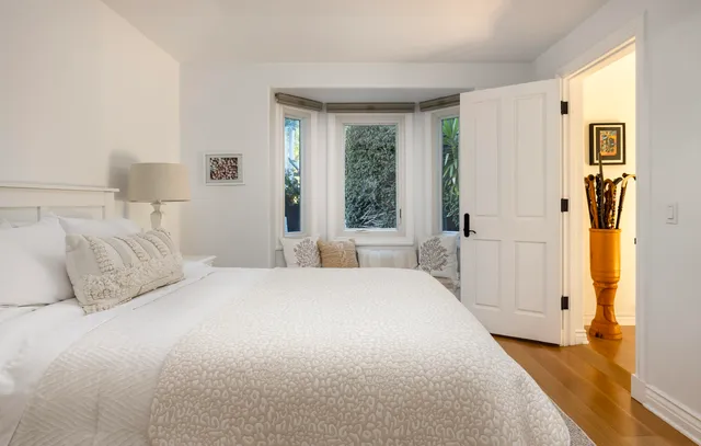 a view of a house with backyard sitting area and swimming pool