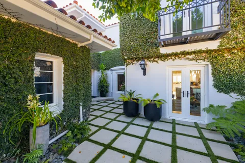 a view of a house with a tree