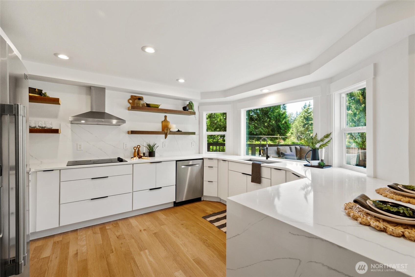 706 Fieldston Road Bellingham, WA 98225 - Photo 11 of 40 a kitchen with sink refrigerator and large window
