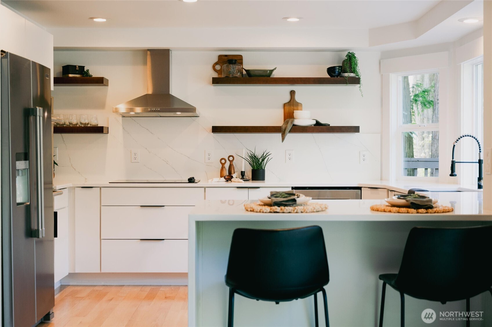 706 Fieldston Road Bellingham, WA 98225 - Photo 12 of 40 a kitchen with stainless steel appliances a sink and cabinets