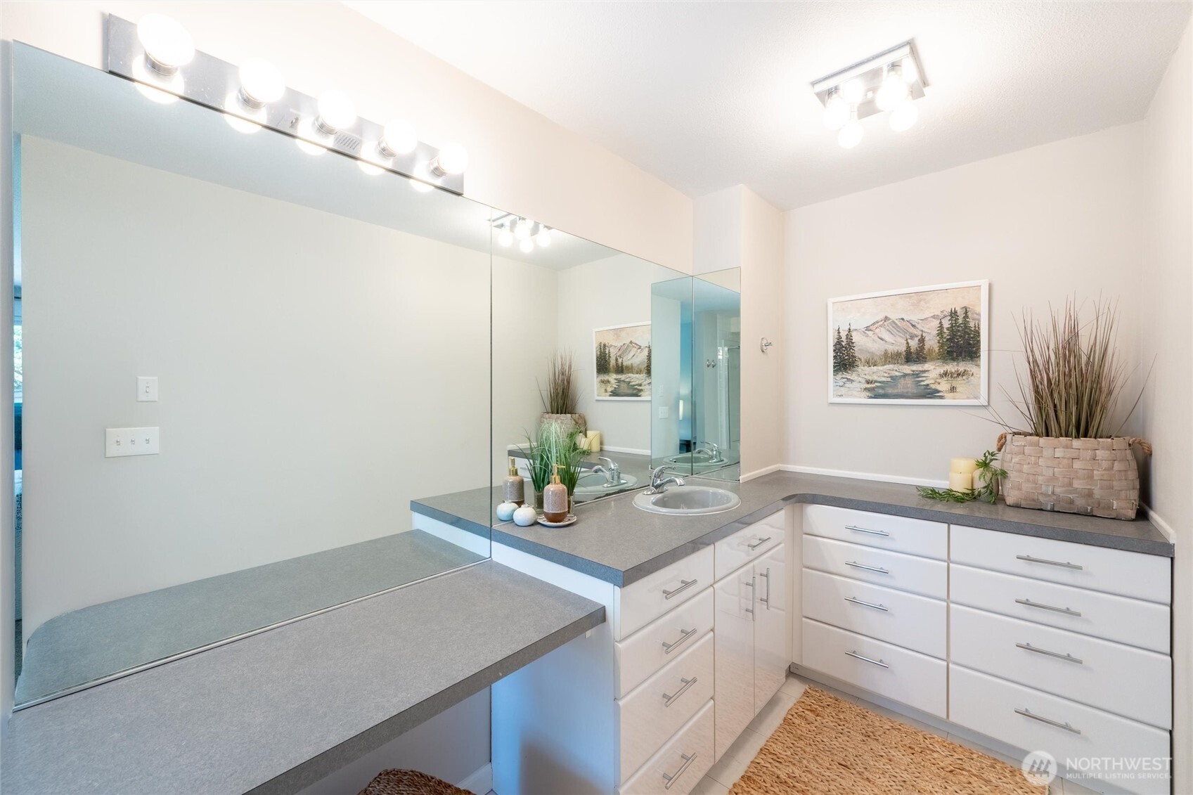 706 Fieldston Road Bellingham, WA 98225 - Photo 26 of 40 a spacious bathroom with a granite countertop sink and a mirror