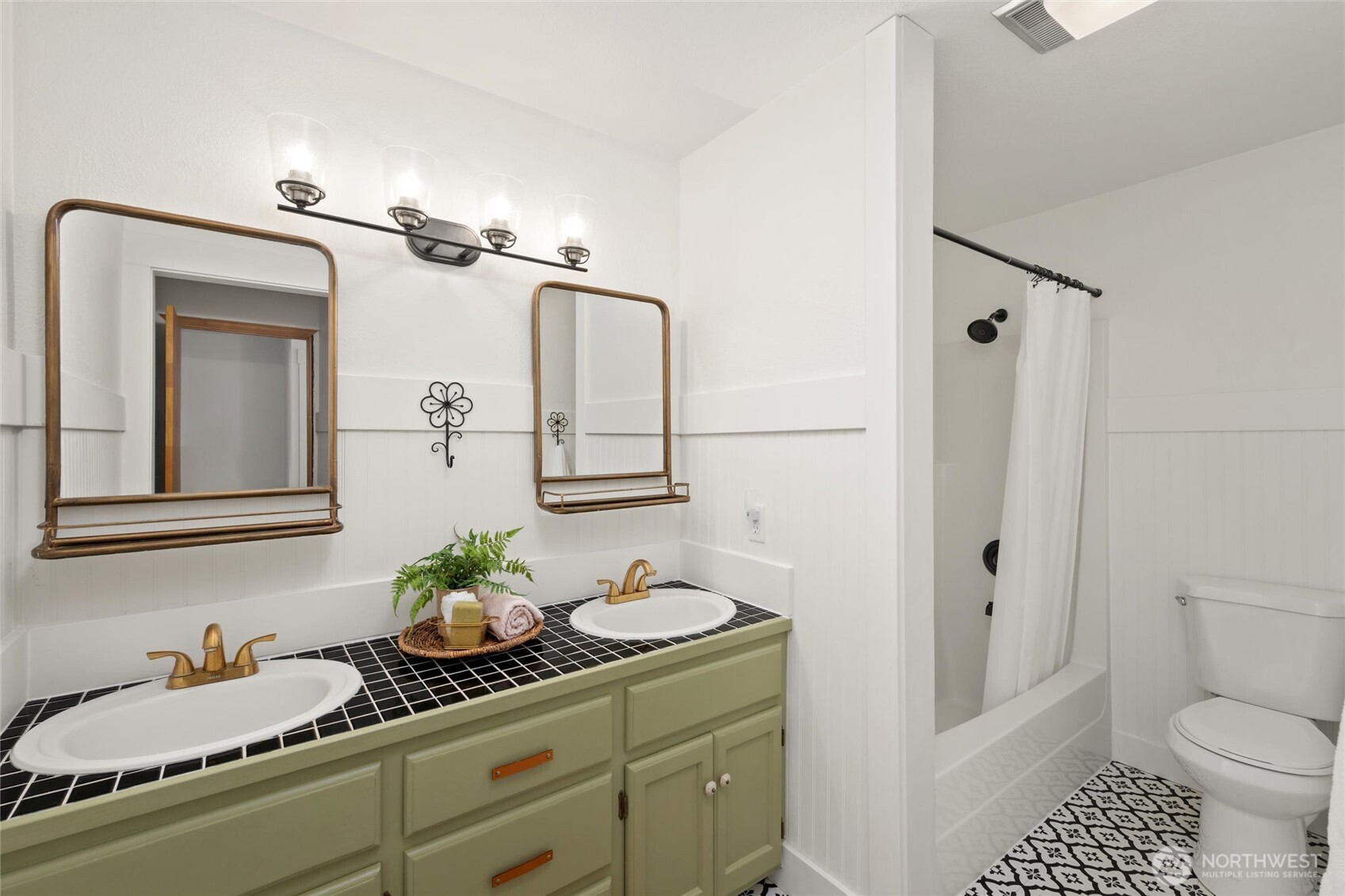 706 Fieldston Road Bellingham, WA 98225 - Photo 31 of 40 a bathroom with a granite countertop sink a toilet and a mirror
