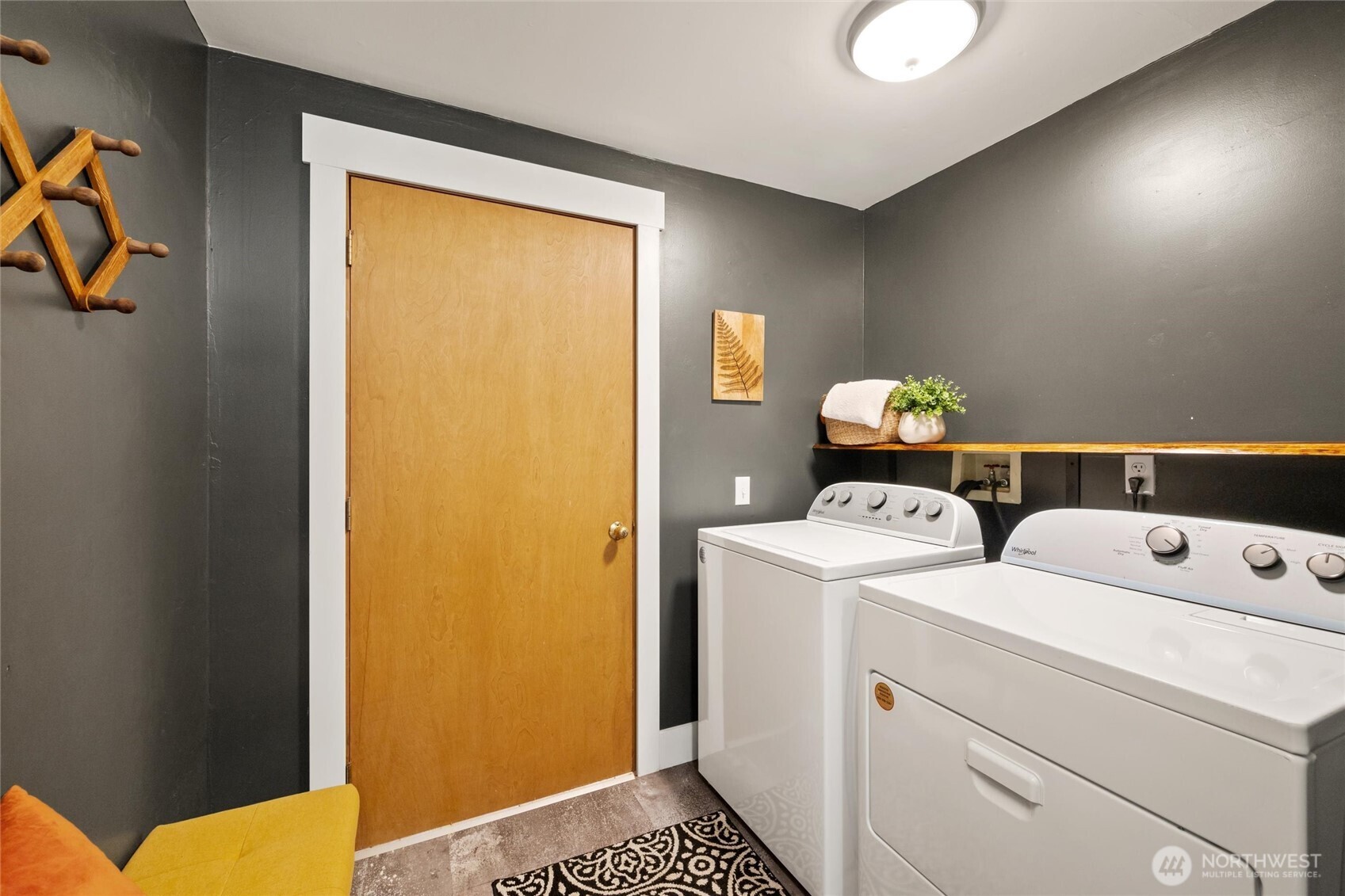 706 Fieldston Road Bellingham, WA 98225 - Photo 34 of 40 a view of washer and dryer with kitchen in the background