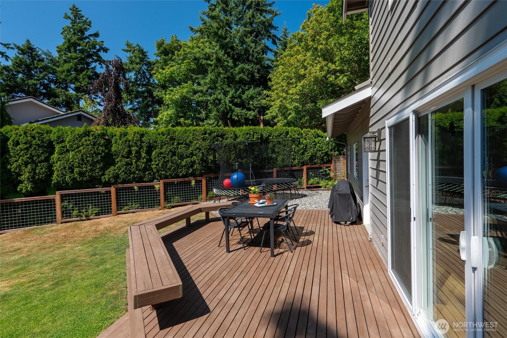 706 Fieldston Road Bellingham, WA 98225 - Photo 37 of 40 a view of house with deck outdoor seating and green space