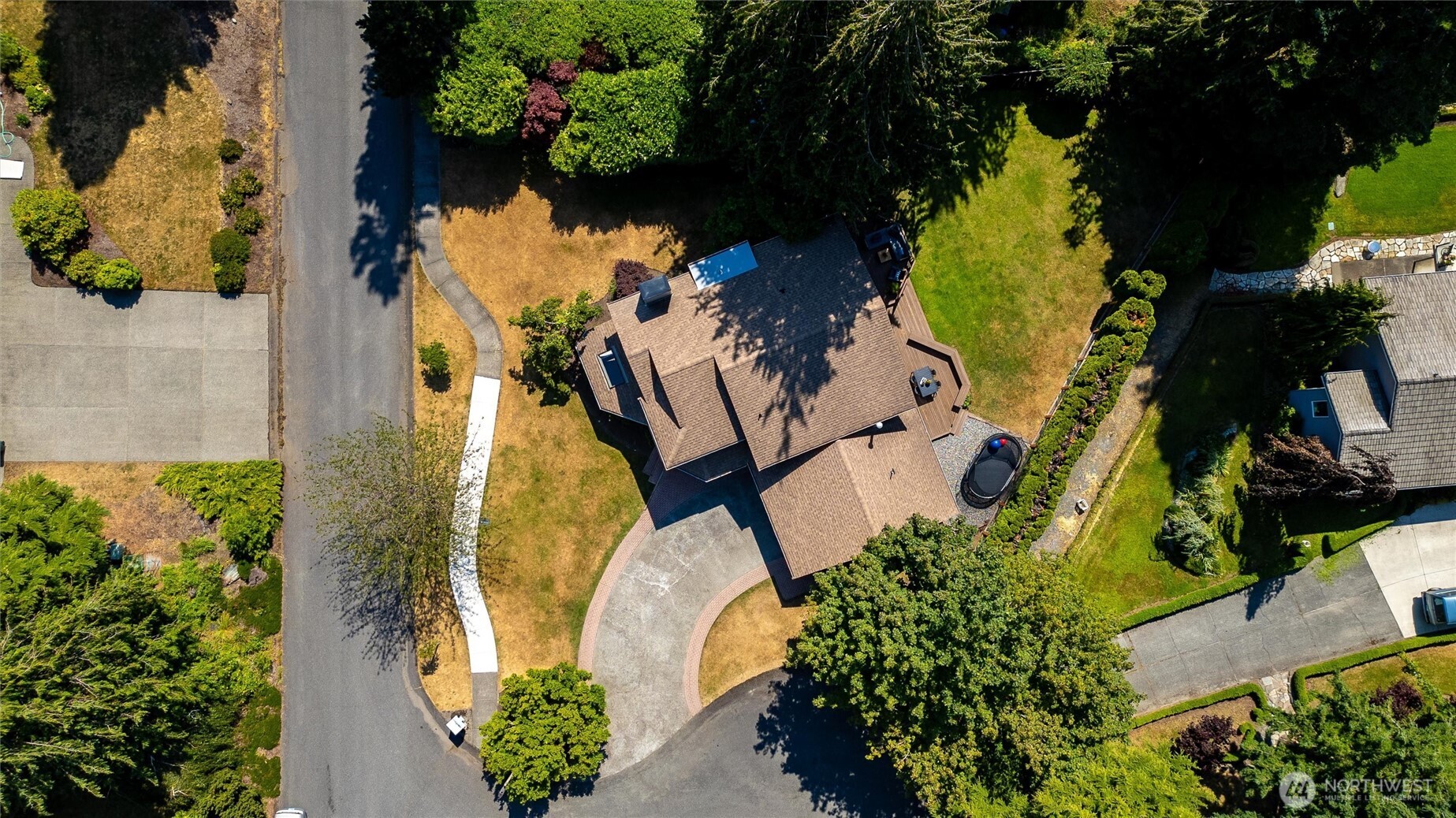 706 Fieldston Road Bellingham, WA 98225 - Photo 40 of 40 an aerial view of a swimming pool with outdoor seating and garden