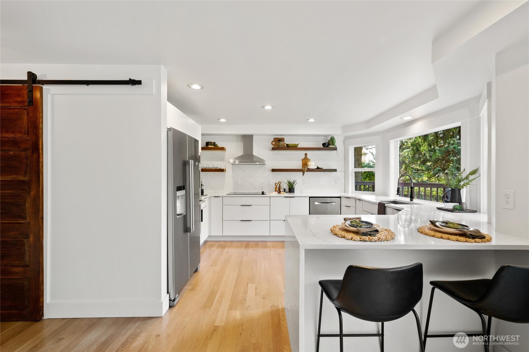 706 Fieldston Road Bellingham, WA 98225 - Photo 10 of 40 a kitchen with stainless steel appliances granite countertop a refrigerator and a stove top oven