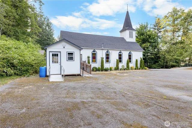 a bathroom with a toilet sink and shower