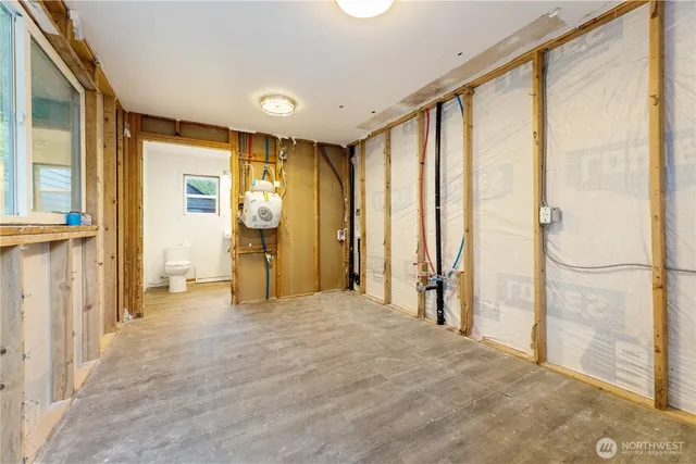 a view of a field with trees in the background