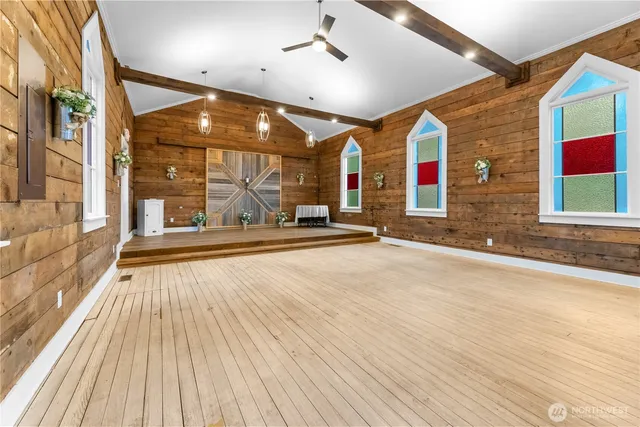 a living room with furniture a window and a table