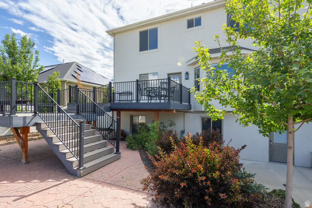 868 Braddock Lane Alpine, UT 84004 - Photo 57 of 64 Multi-level outdoor deck featuring composite decking and black metal railings