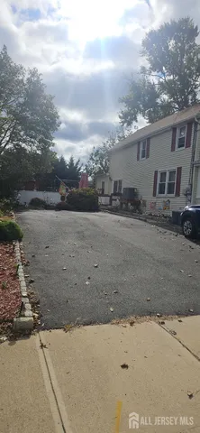 a living room with furniture a fireplace and a chandelier