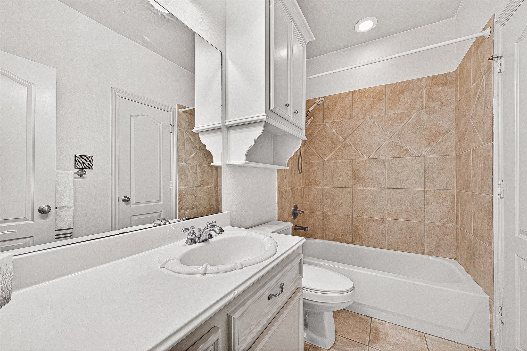 25626 Windy Isle Court Spring, TX 77389 - Photo 30 of 45 It also comes with a full bathroom. This bathroom also serves the in-home theater and game room.