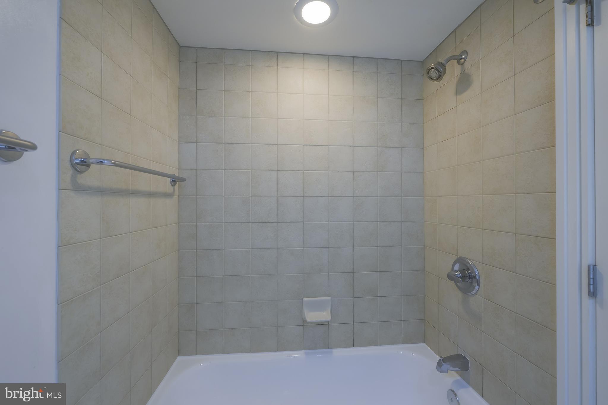 800 4th Street Southwest, Unit N518 Washington, DC 20024 - Photo 18 of 26 a bathroom with a shower