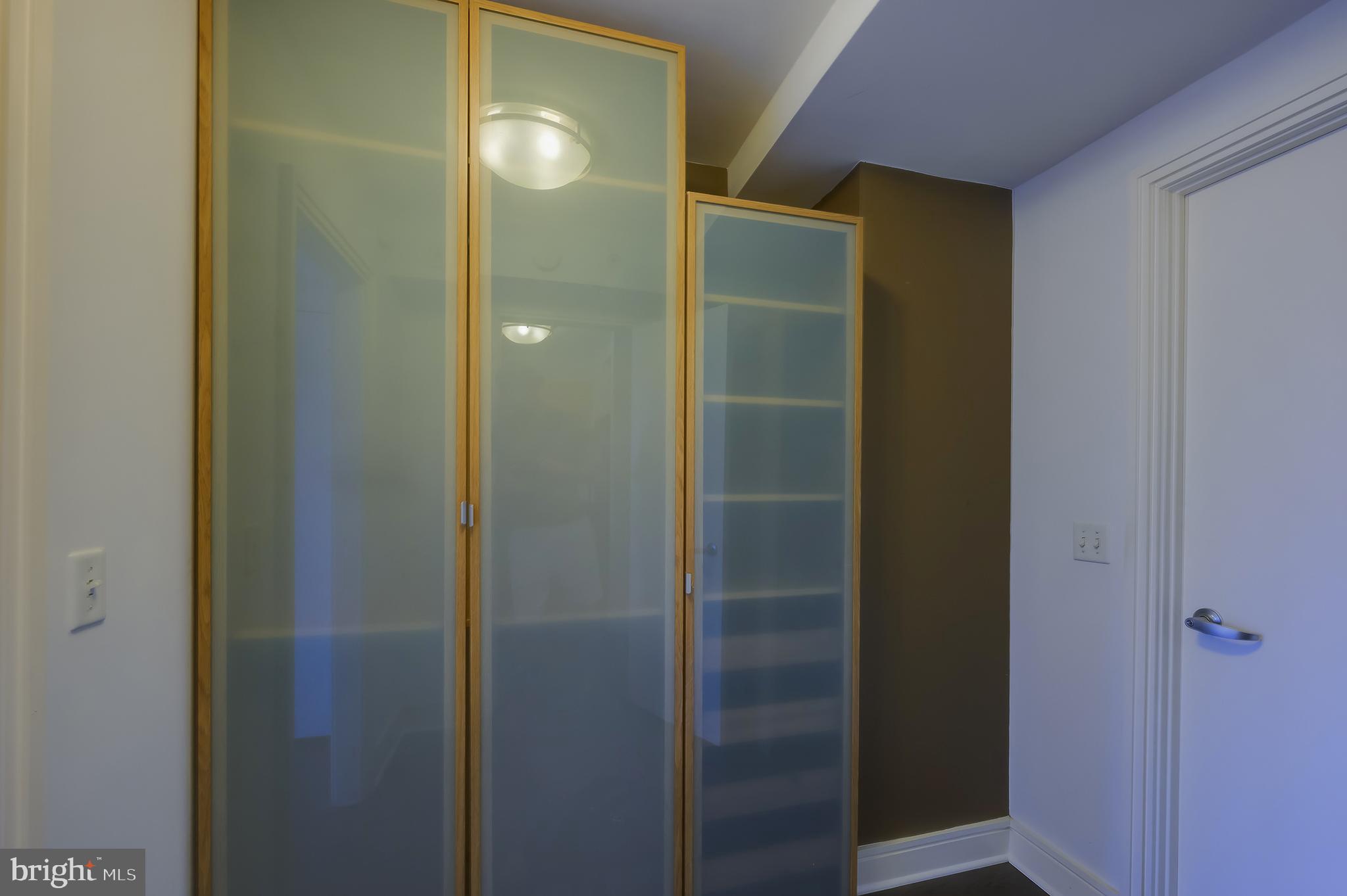 800 4th Street Southwest, Unit N518 Washington, DC 20024 - Photo 19 of 26 a bathroom with a glass shower door and sink