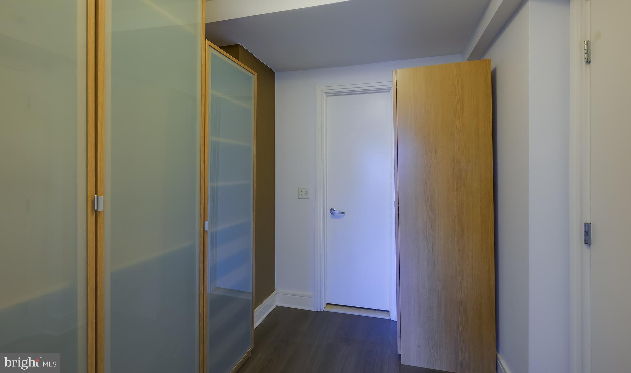 800 4th Street Southwest, Unit N518 Washington, DC 20024 - Photo 20 of 26 a view of a hallway with wooden floor