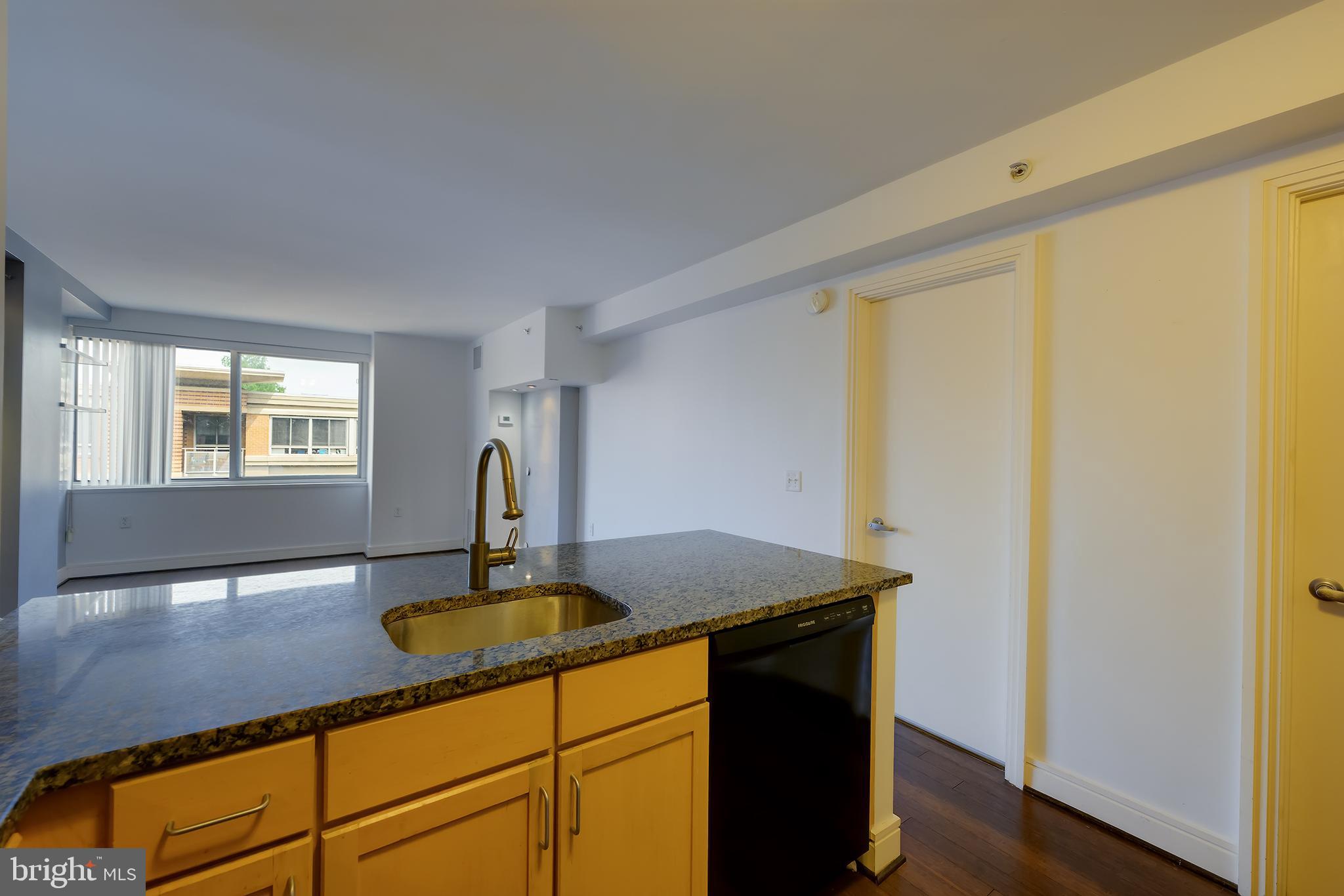 800 4th Street Southwest, Unit N518 Washington, DC 20024 - Photo 6 of 26 a kitchen with a sink and a refrigerator