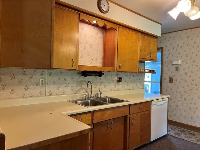 a kitchen with a sink and cabinets