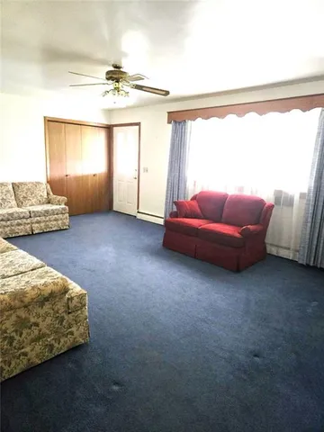 a living room with furniture and window