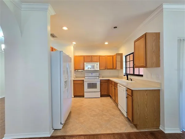 a large kitchen with a stove top oven