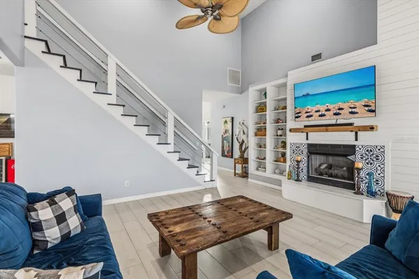 a living room with furniture and a fireplace