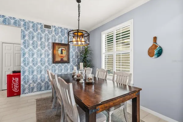 a view of a dining room with furniture window and outside view