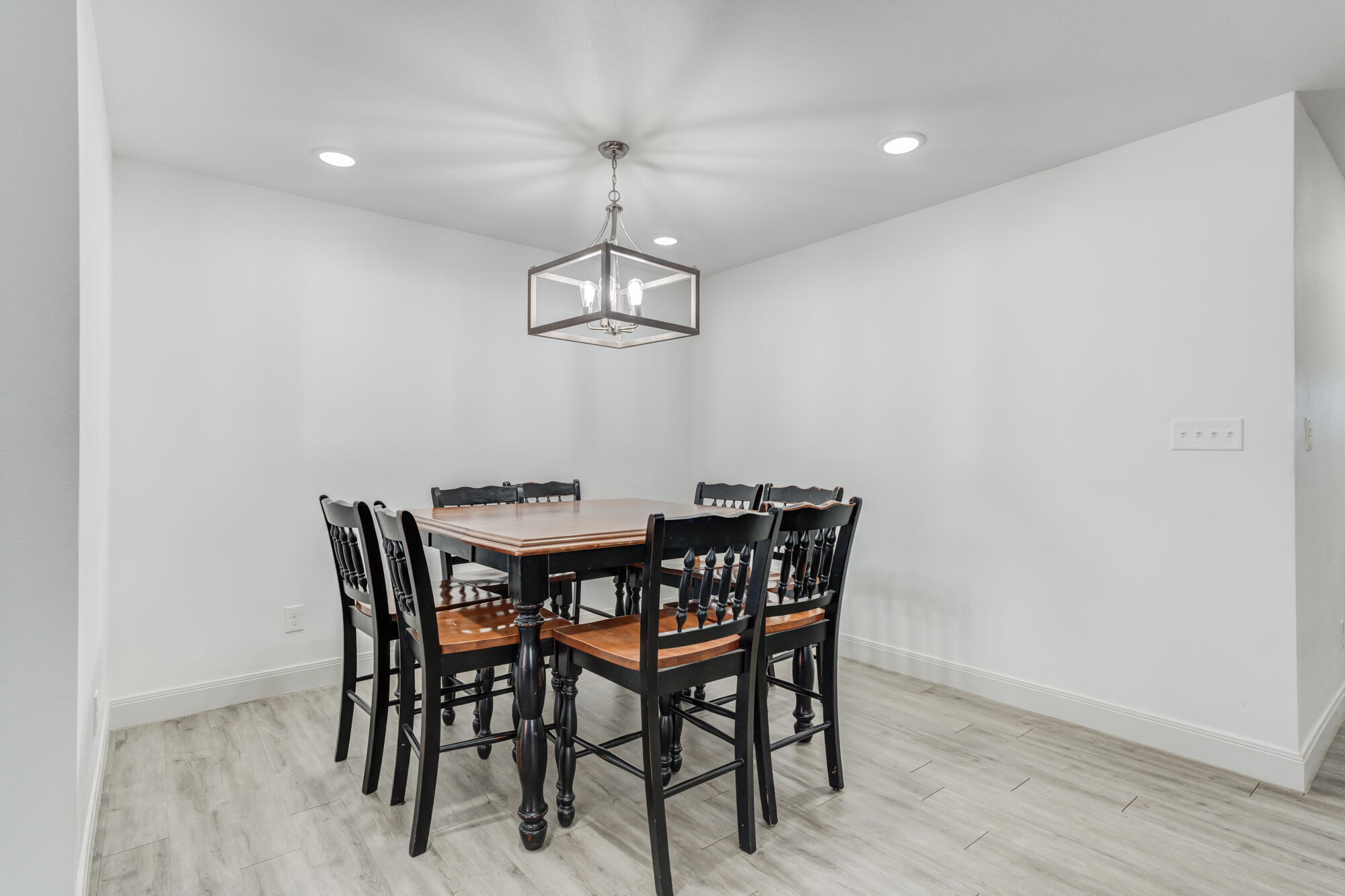 7020 24th Street Lubbock, TX 79407 - Photo 16 of 31 a view of a dining room with furniture and wooden floor