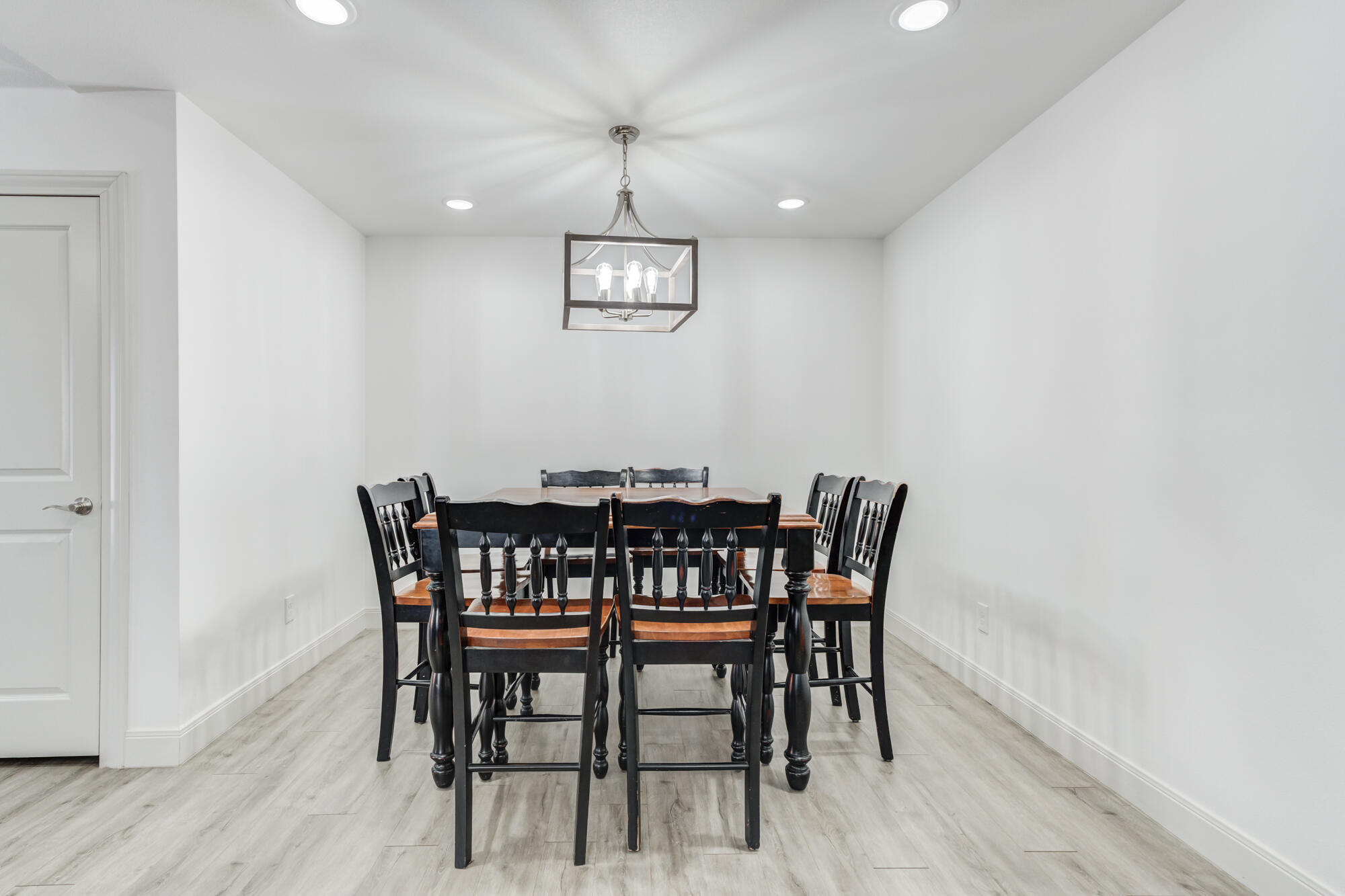 7020 24th Street Lubbock, TX 79407 - Photo 17 of 31 a view of a dining room with furniture and wooden floor