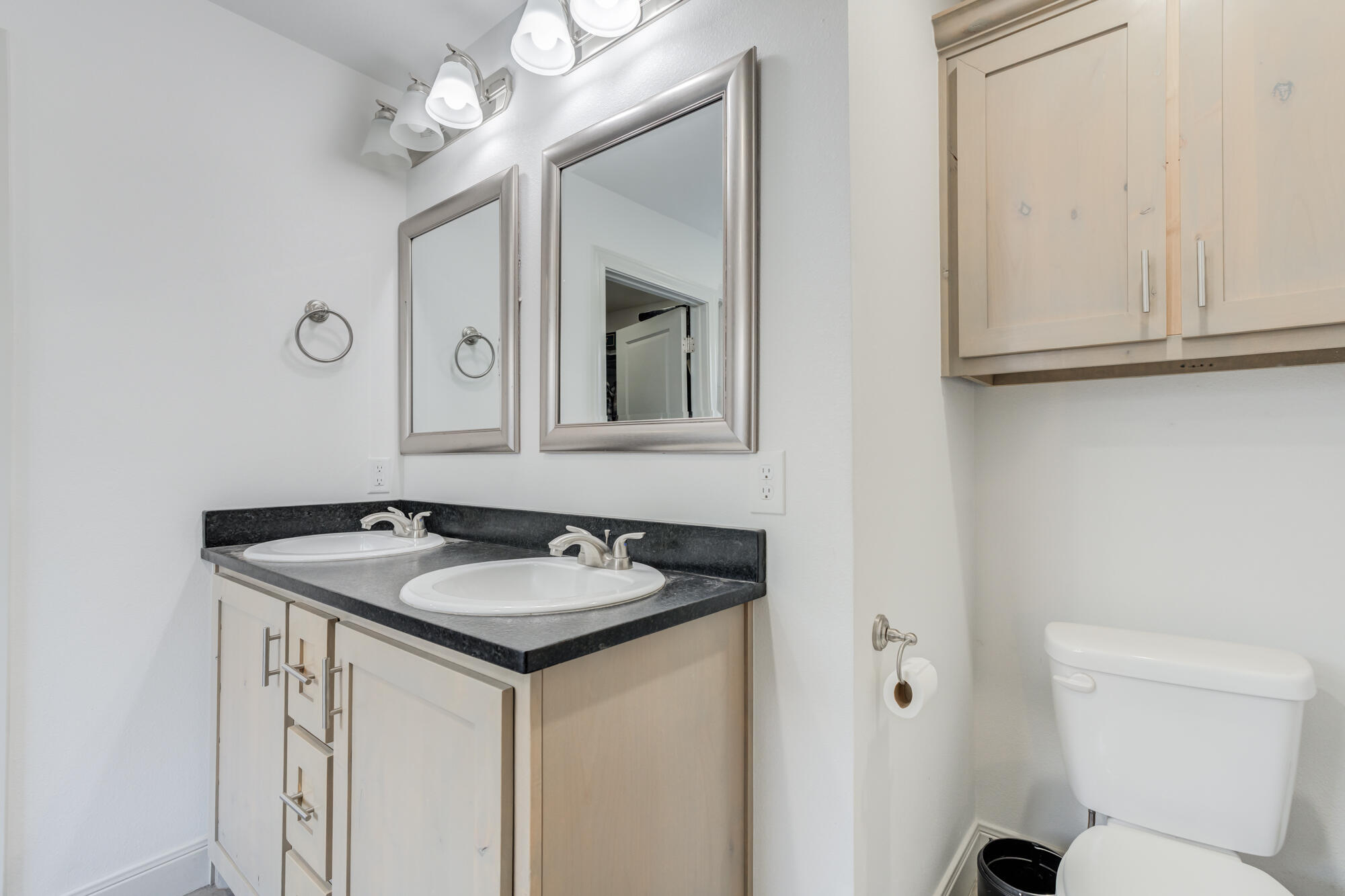 7020 24th Street Lubbock, TX 79407 - Photo 19 of 31 a bathroom with a sink and a mirror