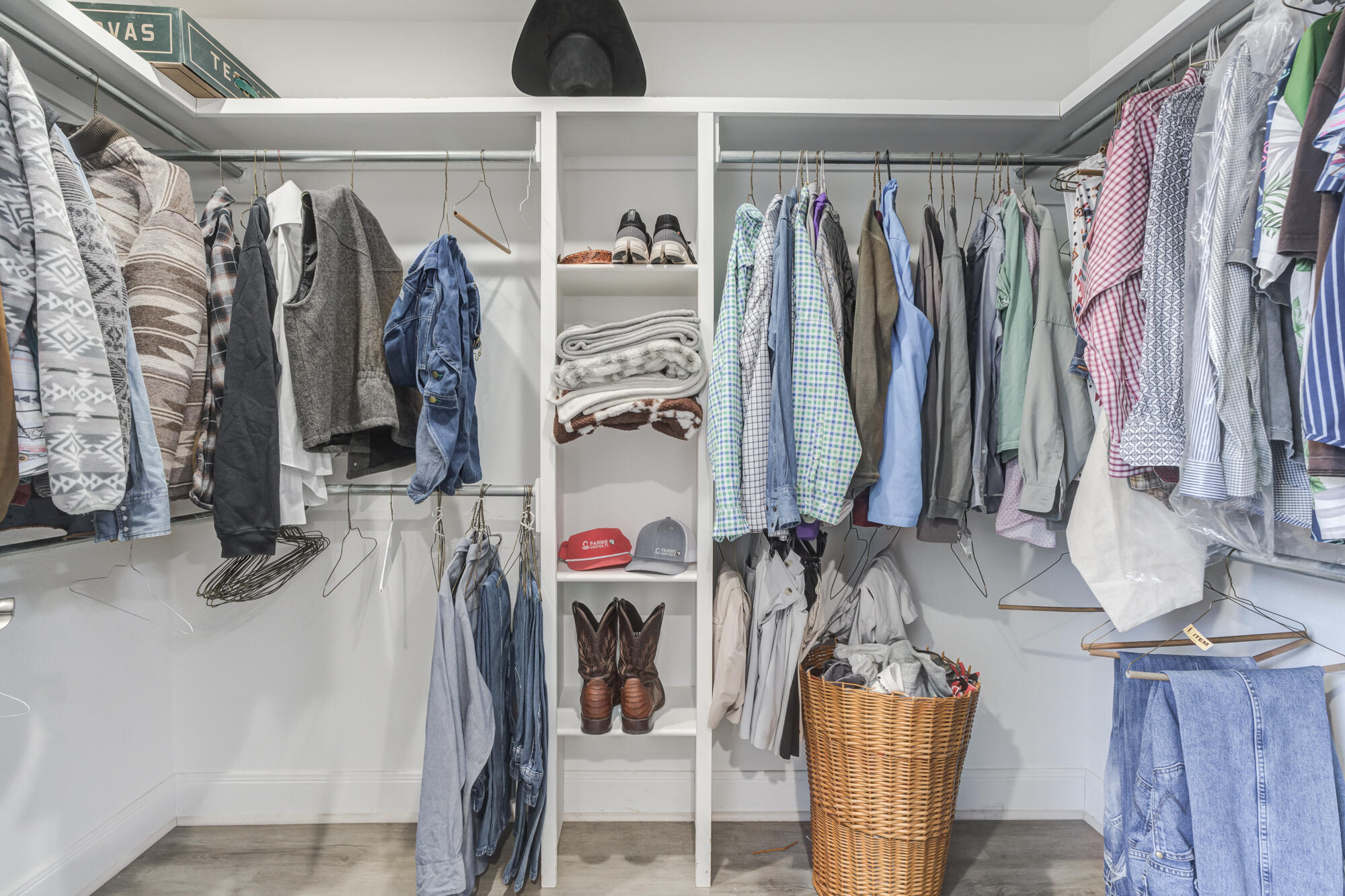 7020 24th Street Lubbock, TX 79407 - Photo 22 of 31 a view of walk in closet with clothes