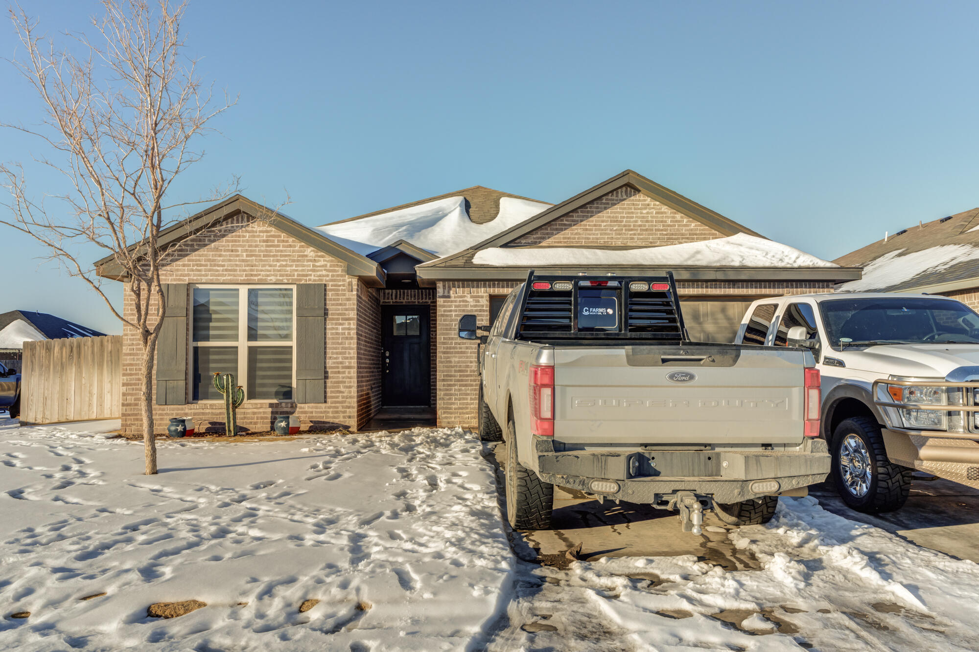 7020 24th Street Lubbock, TX 79407 - Photo 6 of 31 a front view of a house with a yard