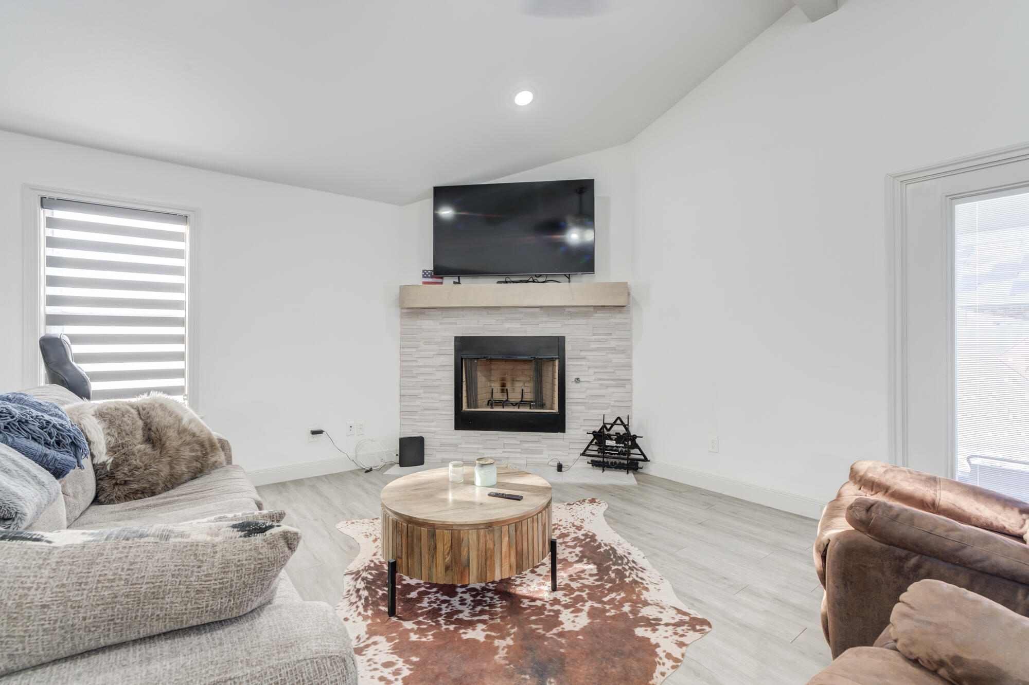 7020 24th Street Lubbock, TX 79407 - Photo 9 of 31 a living room with furniture and a fireplace