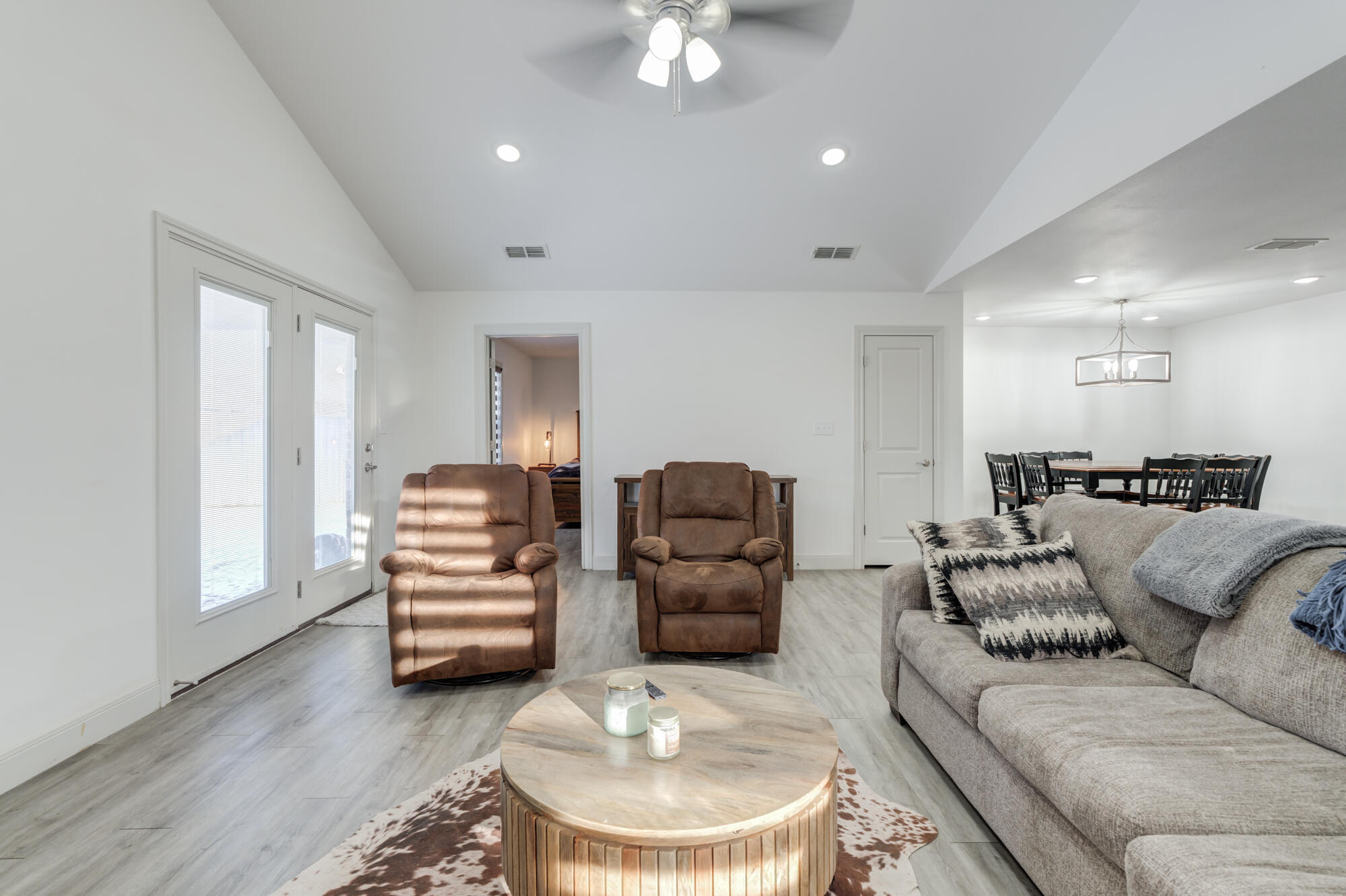 7020 24th Street Lubbock, TX 79407 - Photo 10 of 31 a living room with furniture and a wooden floor