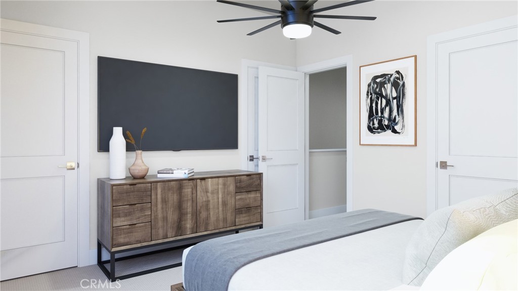 76 Bigsby Drive Stanton, CA 90680 - Photo 8 of 13 a bedroom with a bed and a flat tv screen