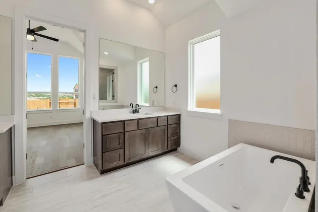 a bathroom with a bathtub and a sink