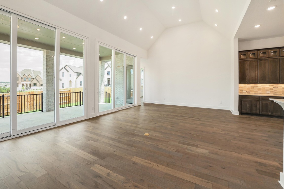 1604 Lilly Grace Bend Leander, TX 78641 - Photo 16 of 22 a view of an empty room with glass door and a window