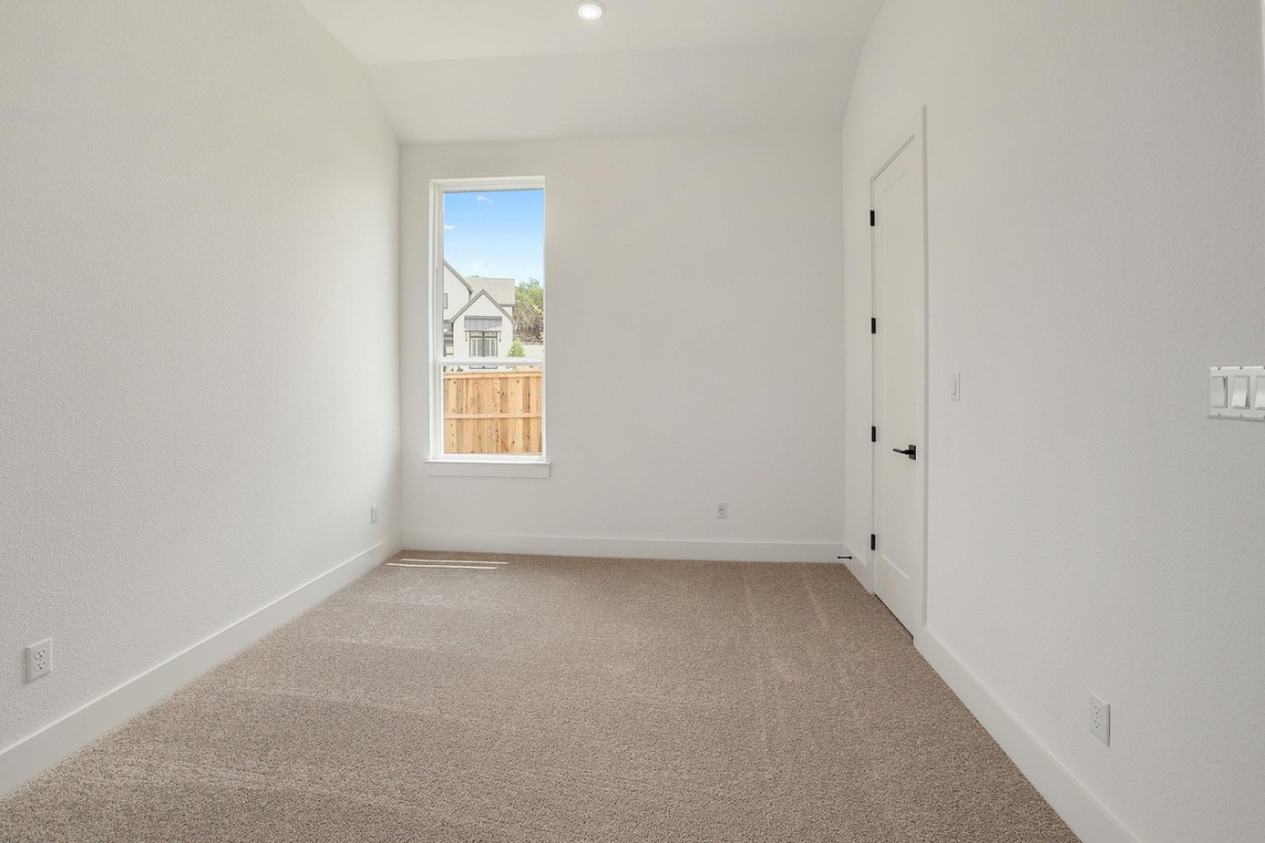 1604 Lilly Grace Bend Leander, TX 78641 - Photo 18 of 22 a view of an empty room with a window