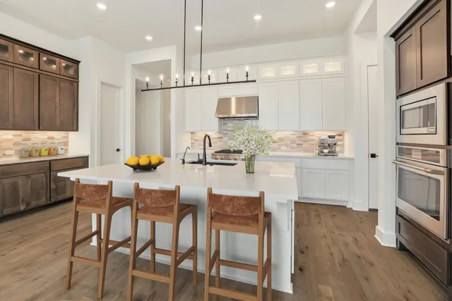 a kitchen with a sink cabinets and window