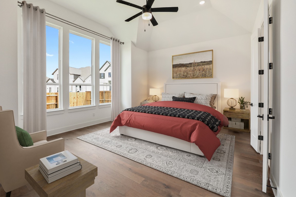 1604 Lilly Grace Bend Leander, TX 78641 - Photo 4 of 22 a bedroom with a bed and wooden floor